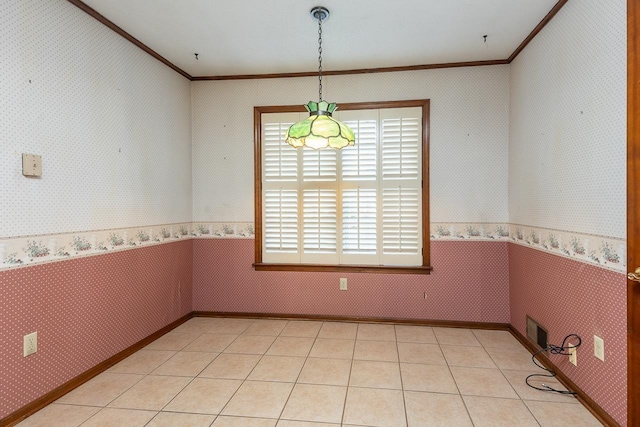 empty room featuring wallpapered walls, visible vents, ornamental molding, and light tile patterned flooring