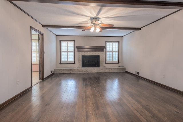 unfurnished living room featuring dark wood-style floors, beam ceiling, and visible vents