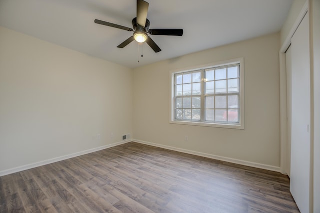 unfurnished bedroom featuring hardwood / wood-style flooring and ceiling fan