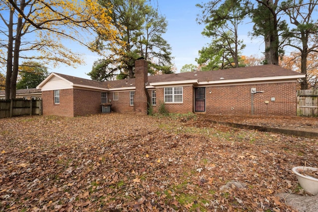 rear view of property with central AC unit