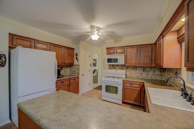 kitchen featuring decorative backsplash, sink, white appliances, and light wood-type flooring