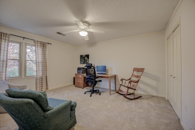 carpeted office featuring a textured ceiling, ceiling fan, and crown molding