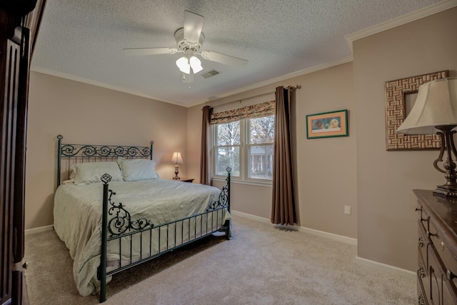 bedroom featuring ceiling fan, crown molding, light colored carpet, and a textured ceiling