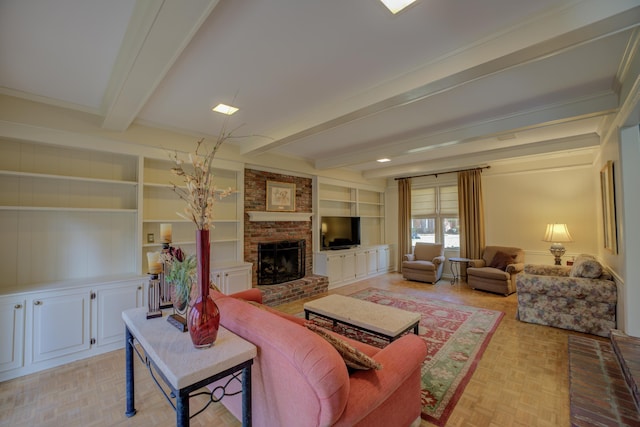 living room with beam ceiling, built in shelves, a brick fireplace, light parquet floors, and ornamental molding