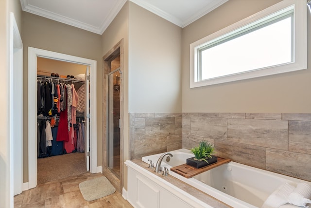 bathroom featuring separate shower and tub and crown molding