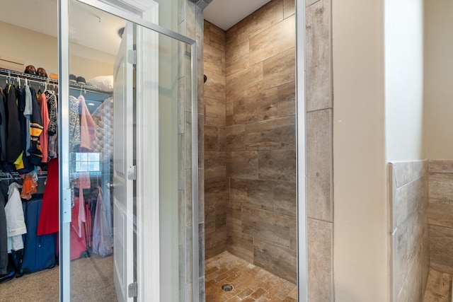 bathroom with a shower with shower door