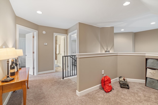 interior space featuring light carpet