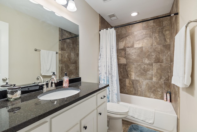 full bathroom with vanity, toilet, and shower / bath combo with shower curtain