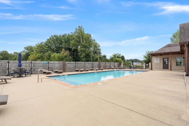 view of swimming pool featuring a patio area