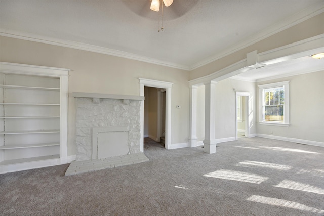 unfurnished living room featuring carpet flooring, a fireplace, crown molding, and ceiling fan