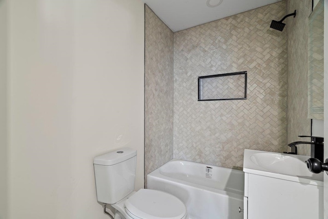 full bathroom with vanity, toilet, and tiled shower / bath combo