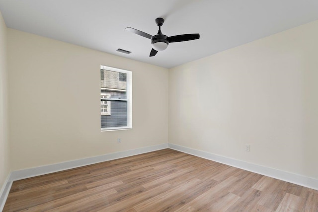 spare room with light hardwood / wood-style floors