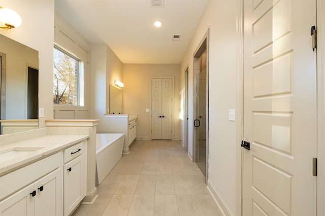 bathroom featuring separate shower and tub, tile patterned flooring, and vanity