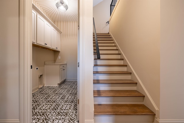 staircase featuring tile patterned flooring