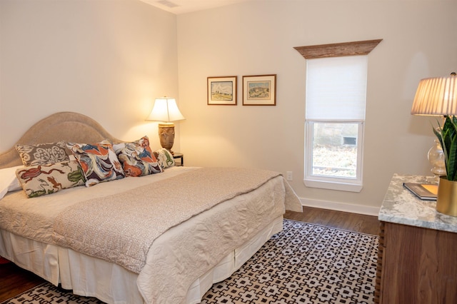 bedroom featuring dark wood-type flooring