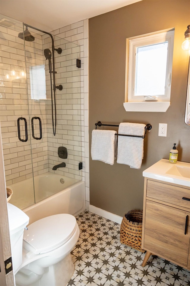 full bathroom featuring vanity, enclosed tub / shower combo, and toilet