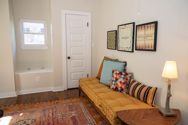 living area with dark hardwood / wood-style flooring