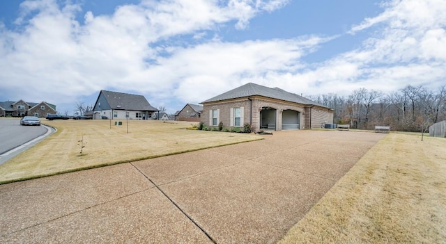 view of side of property featuring a yard