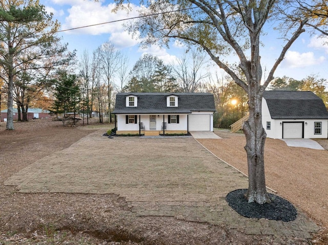 view of front facade with an outdoor structure, a front lawn, and a porch