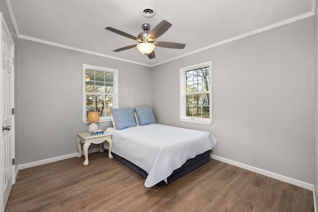 bedroom with multiple windows, ceiling fan, and dark wood-type flooring