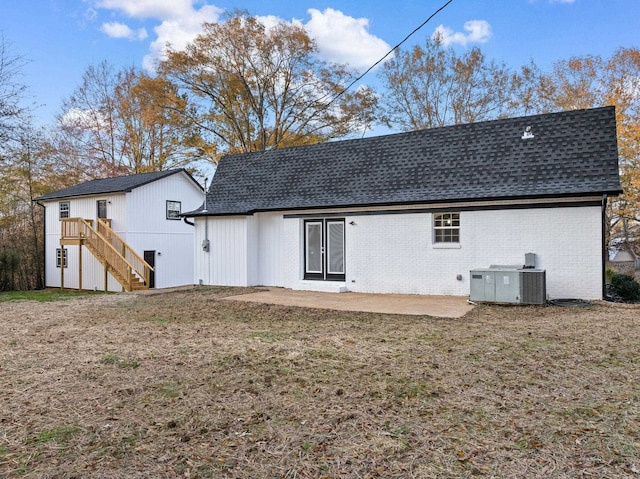 rear view of property with a patio area and cooling unit