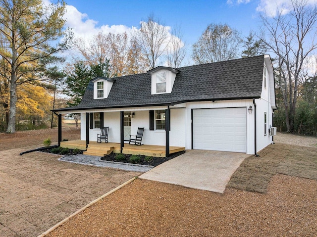 view of front of house featuring a porch and a garage