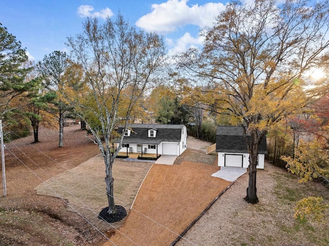 view of front of house featuring a porch and a garage