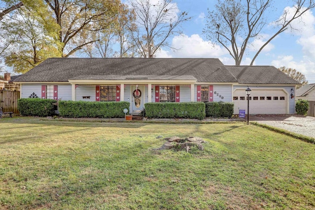 ranch-style home featuring a front yard and a garage