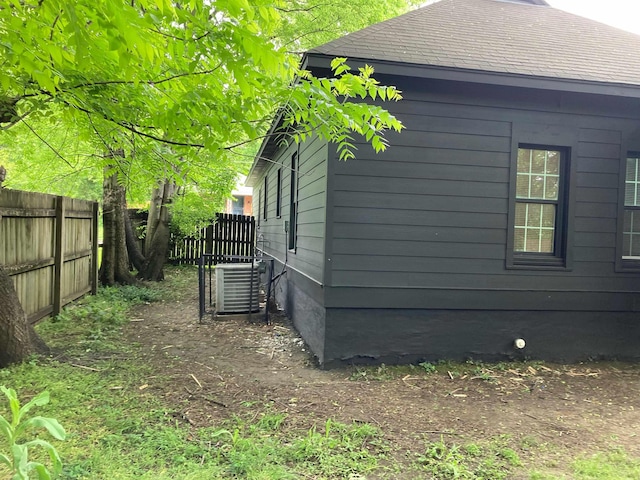 view of side of property featuring central AC unit