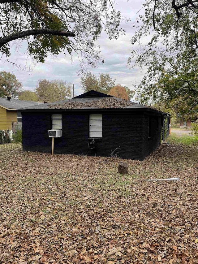 view of side of home with cooling unit