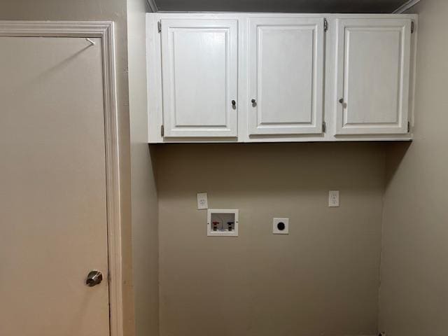 clothes washing area featuring hookup for a washing machine, cabinets, and hookup for an electric dryer