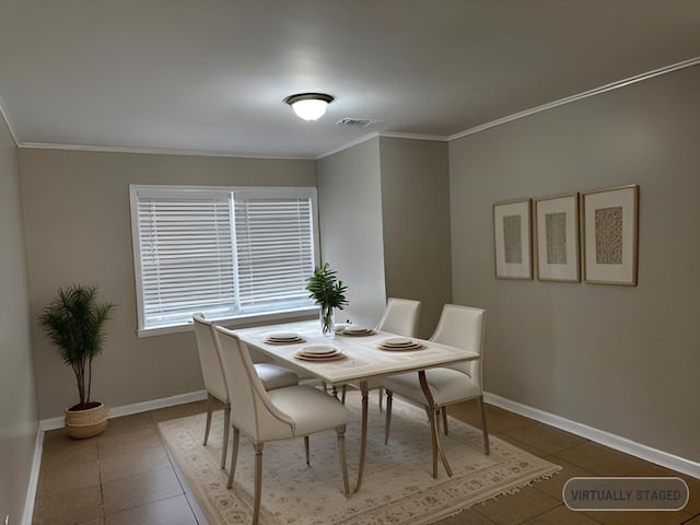 tiled dining room with ornamental molding