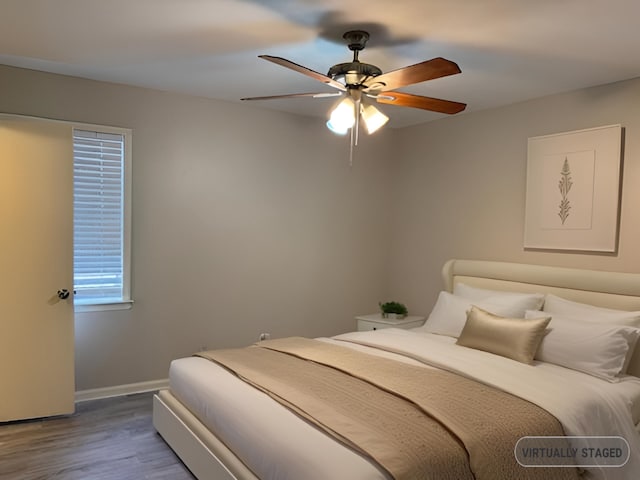 bedroom with hardwood / wood-style flooring and ceiling fan