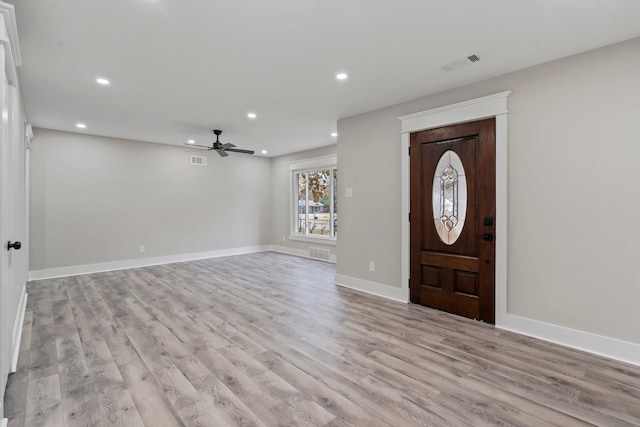 entryway with light hardwood / wood-style flooring and ceiling fan