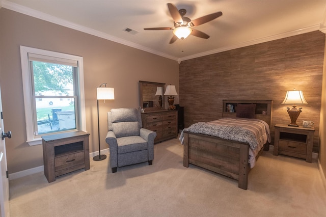 bedroom with carpet, ceiling fan, and ornamental molding