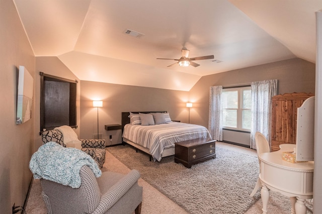 bedroom with carpet floors, vaulted ceiling, and ceiling fan