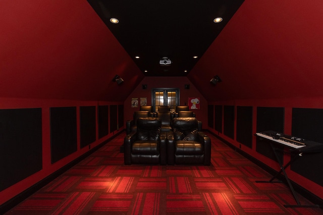 carpeted cinema featuring lofted ceiling