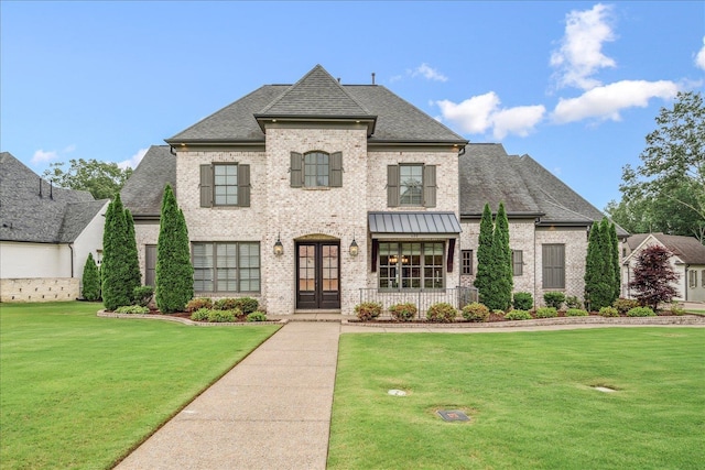 680 Magnolia Ln, Piperton, TN 38017 - french provincial home with brick siding, a front yard, a shingled roof, and french doors