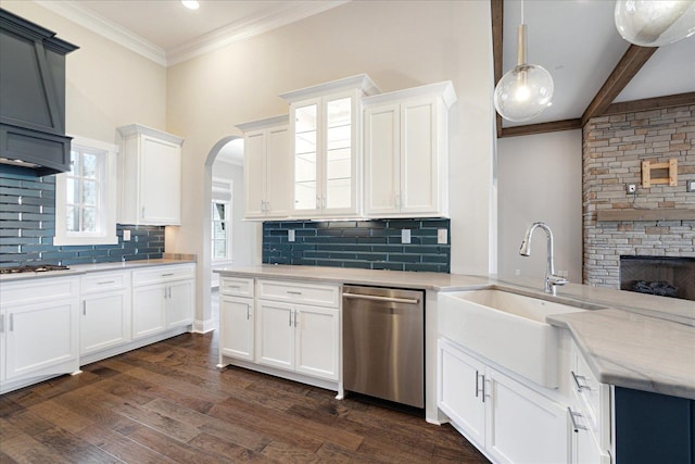 680 Magnolia Ln, Piperton, TN 38017 - kitchen with stainless steel dishwasher, white cabinets, decorative backsplash, arched walkways, and glass insert cabinets
