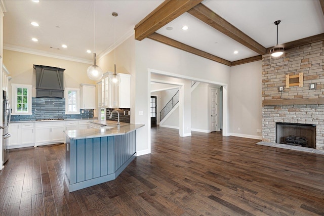 680 Magnolia Ln, Piperton, TN 38017 - kitchen featuring open floor plan, premium range hood, dark wood-type flooring, stainless steel appliances, and backsplash