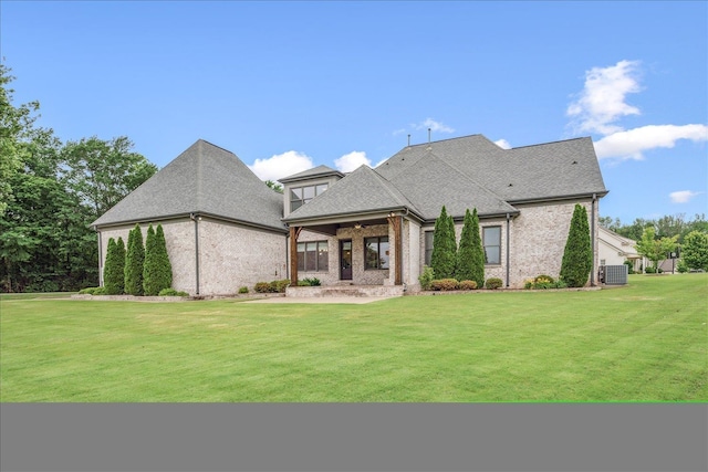 680 Magnolia Ln, Piperton, TN 38017 - back of house featuring a yard, brick siding, ceiling fan, and roof with shingles