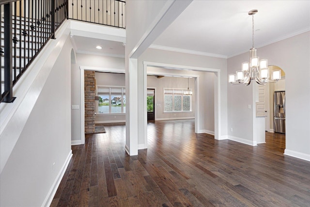 680 Magnolia Ln, Piperton, TN 38017 - entrance foyer featuring a chandelier, dark wood-type flooring, crown molding, stairway, and arched walkways