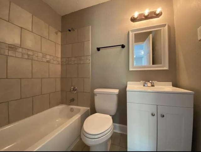 full bathroom featuring vanity, toilet, and tiled shower / bath