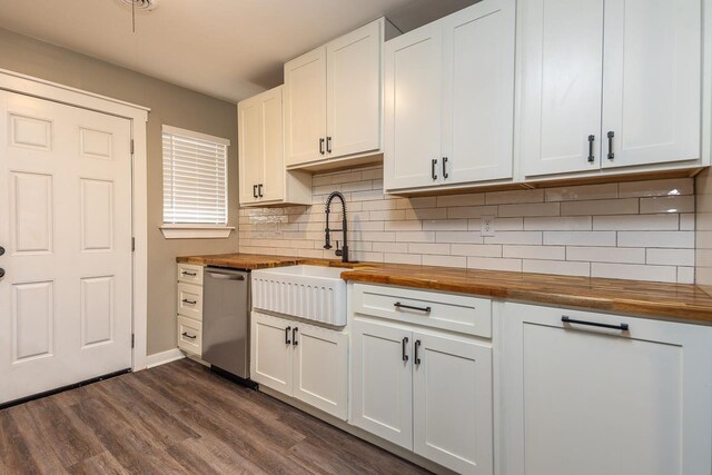 kitchen with white cabinets, stainless steel dishwasher, and wood counters