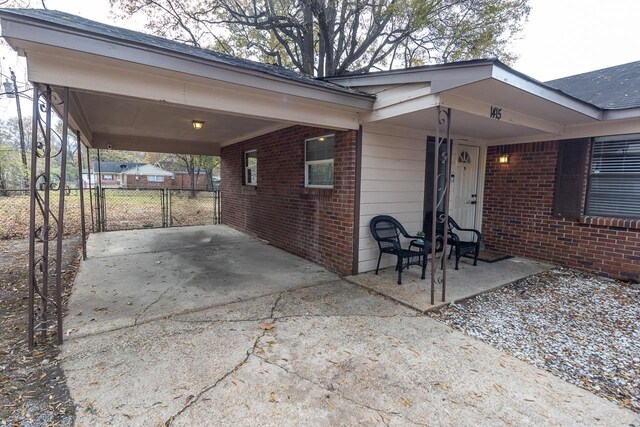 view of patio / terrace featuring a carport