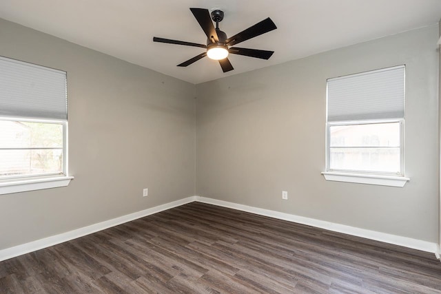 unfurnished room featuring ceiling fan and dark hardwood / wood-style flooring