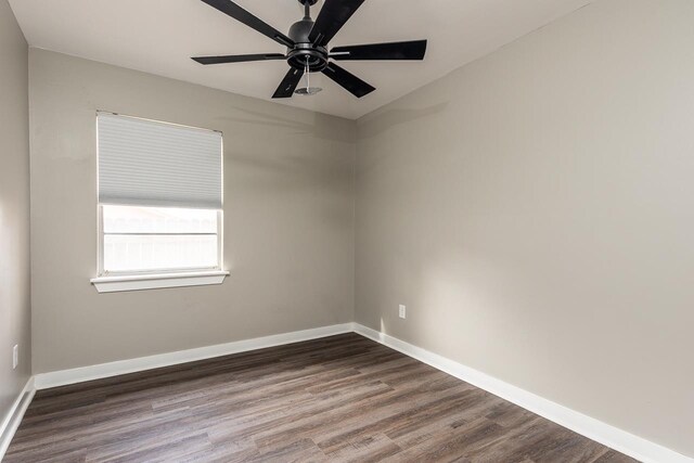 unfurnished room with hardwood / wood-style flooring and ceiling fan