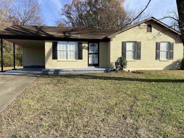 ranch-style home with a carport and a front lawn