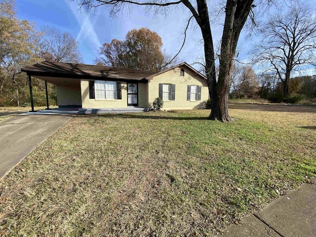 ranch-style house with a front lawn and a carport