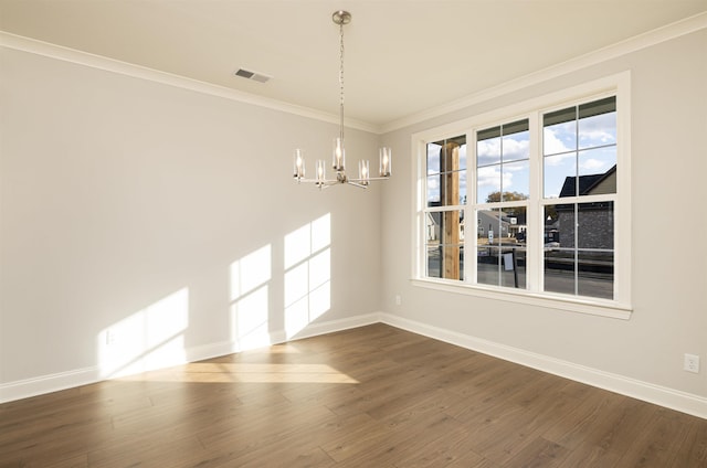 unfurnished dining area with an inviting chandelier, hardwood / wood-style flooring, and crown molding